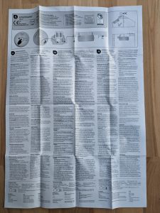 Erster Faltzettel des Smartware FSM 124 Rauchmelders ausgefaltet