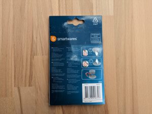Verpackung der Klebehalterung des Smartware FSM 124 Rauchmelders von hinten