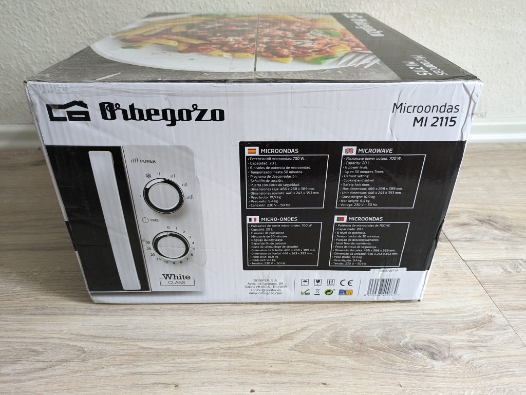 Verpackung der Orbegozo MI 2115 Mikrowelle von links