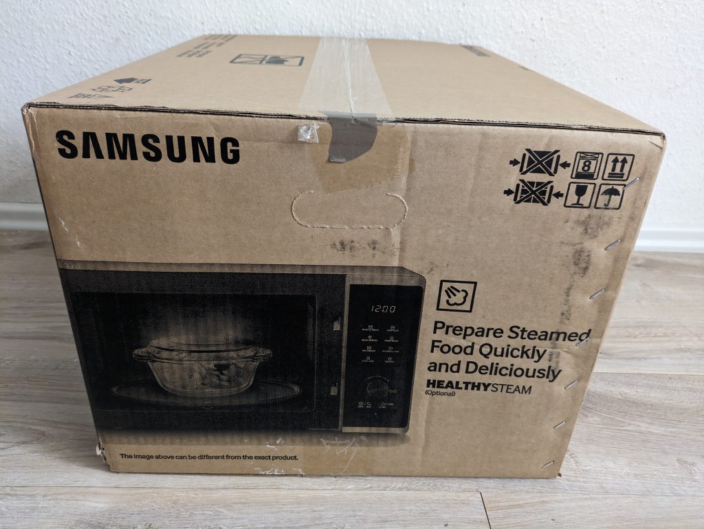 Verpackung der Samsung MS2AK3515ASEG Mikrowelle von links