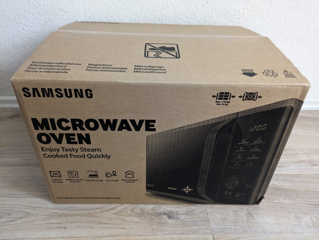 Verpackung der Samsung MS2AK3515ASEG Mikrowelle von vorne