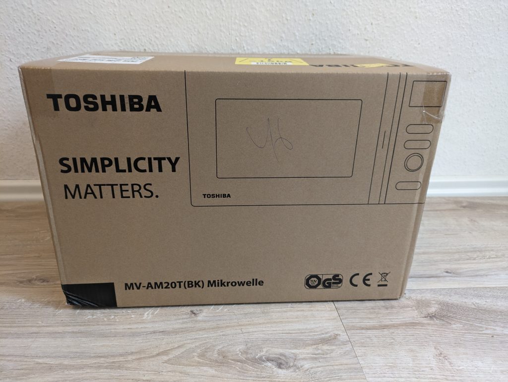 Verpackung der Toshiba MV-AM20T Mikrowelle von vorne