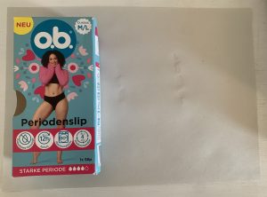 o.b.®-Periodenunterwäsche Blatt Papier nach dem Wassertest