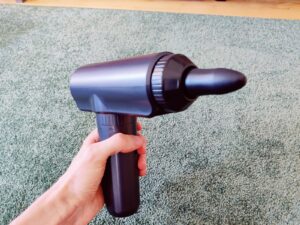 Lefity JX-703S Massagepistole mit Kugelkopf im Betrieb