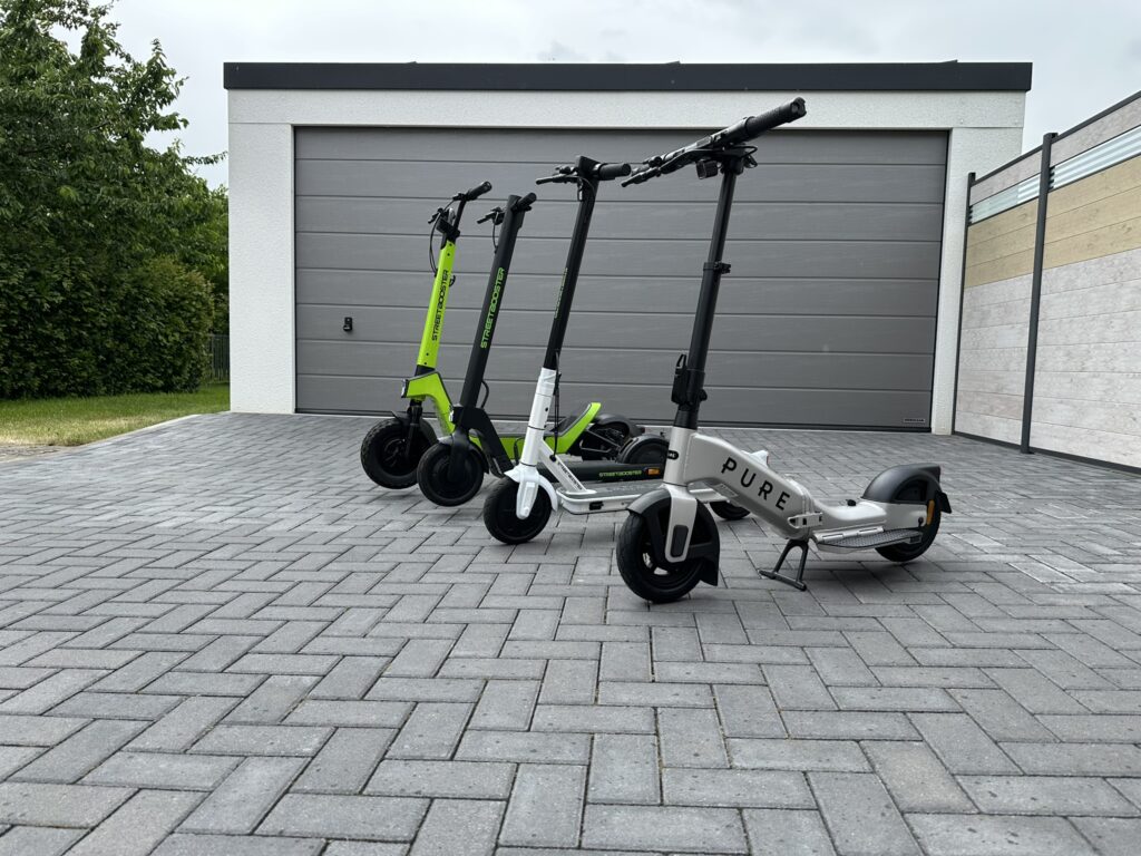 Streetbooster PURE Flex E-Scooter mit weiteren Streetbooster-Modellen