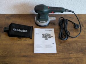 Lieferumfang des Metabo SXE 3125 Exzenterschleifers