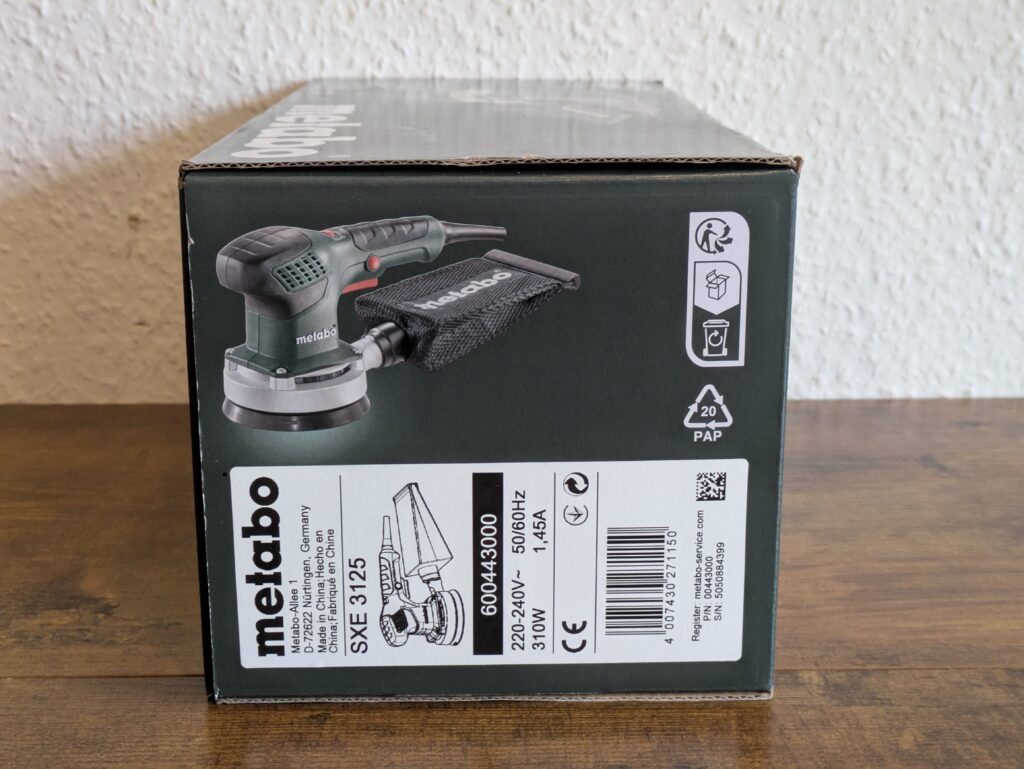Verpackung des Metabo SXE 3125 Exzenterschleifers von links