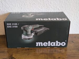 Verpackung des Metabo SXE 3125 Exzenterschleifers von vorne