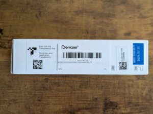 Verpackung des Berrcom JXB-178 Stirnthermometers von links