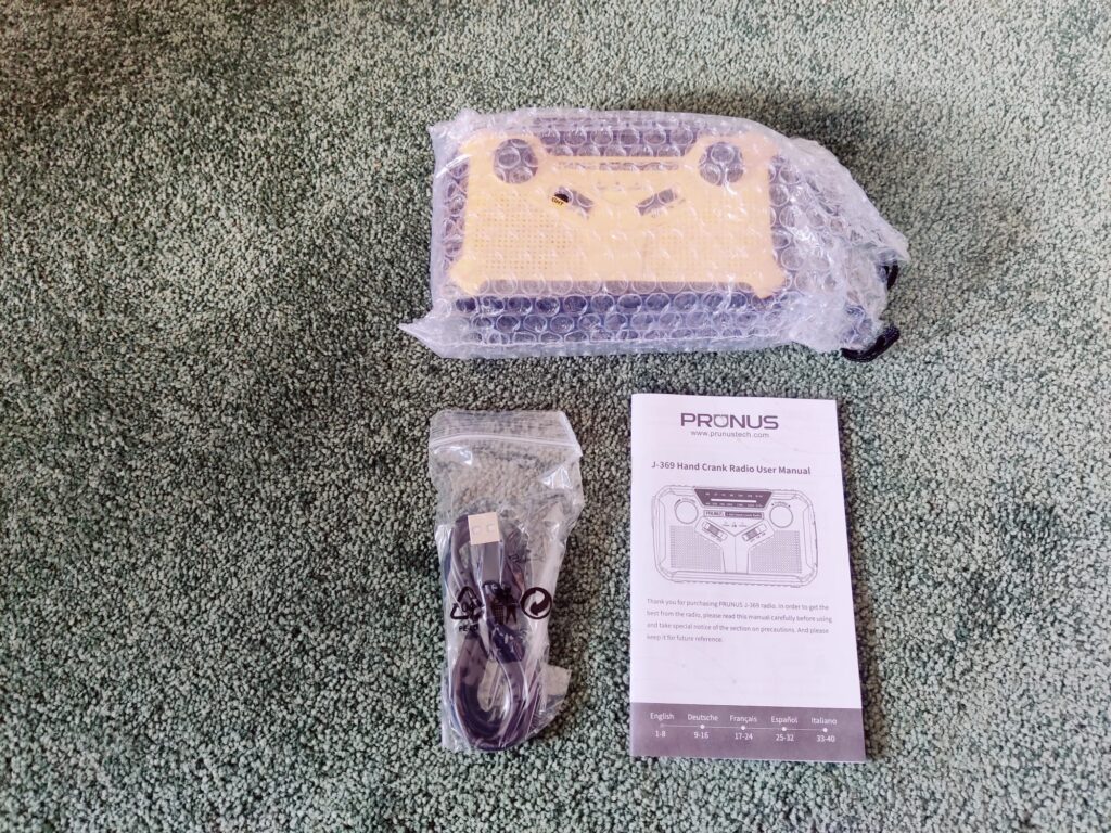Prunus J-369 Kurbelradio in Luftpolsterfolie